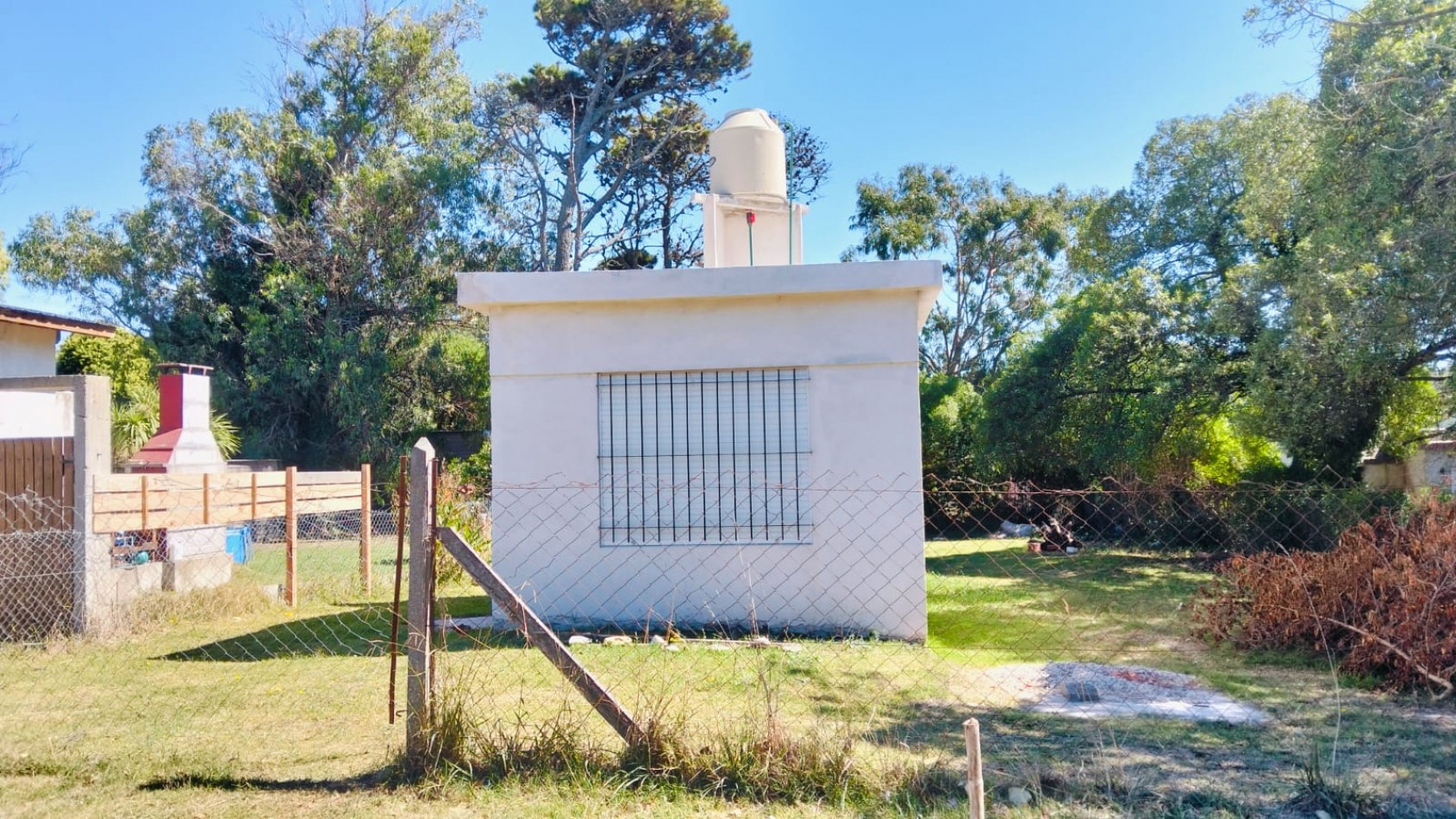 EN VENTA TERRENO CON CONSTRUCCION UN AMBIENTE CON BAÑO