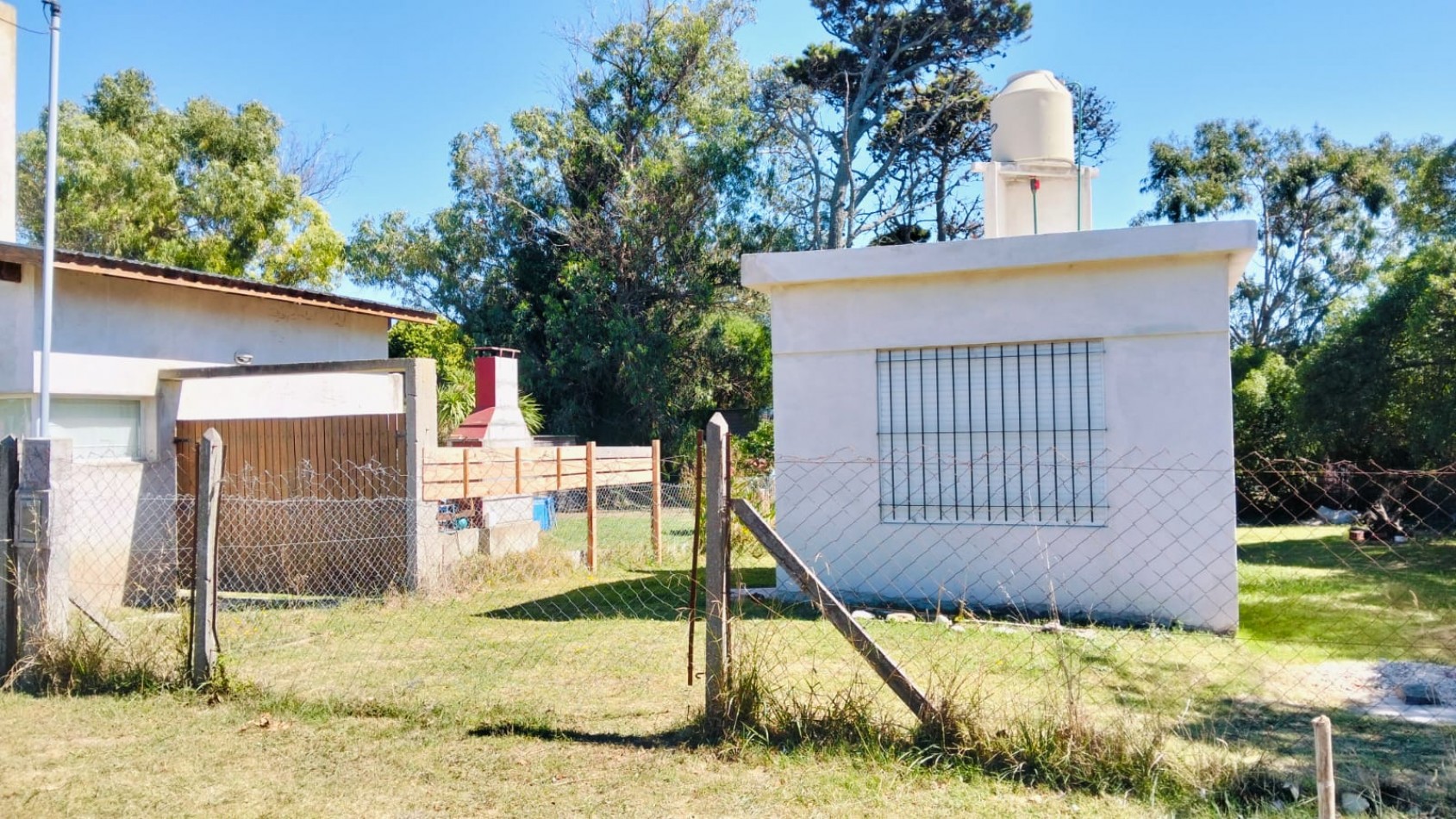 EN VENTA TERRENO CON CONSTRUCCION UN AMBIENTE CON BAÑO